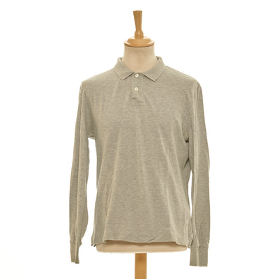This luxury grey polo shirt from Brunello Cucinelli is the perfect addition to your wardrobe. Crafted from 100% cotton, it's lightweight and breathable for maximum comfort. With its elegant design and quality construction, this polo exudes timeless style and will never go out of fashion.