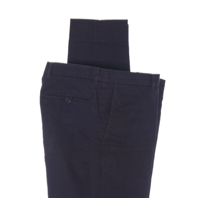 Look your most distinguished with the Gieves & Hawkes Navy Cotton Trousers. Masterfully crafted from premium cotton, the navy trousers emanate sophistication and elegance with a luxurious finish. The regular leg end creates a timelessly stylish silhouette, making them perfect for any formal event. Make a statement of class and refinement with Gieves & Hawkes.