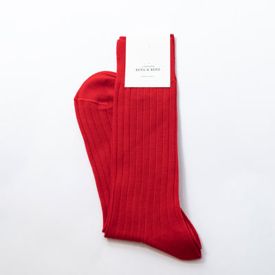 Introducing Berg & Berg's luxurious Red Rib Wool Socks, made of 80% pure merino wool and 20% polyamide. Perfectly tailored to size EU 43-44, this sumptuous pair is excellent for your everyday wardrobe and makes a great addition to formal attire. Unused and in mint condition, these sophisticated socks are a subtle way to add a touch of sophistication to your look.